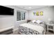 Bedroom offers a cozy space with TV, neutral walls, and a comfortable bed at 9673 Pinebrook St, Highlands Ranch, CO 80130
