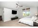 Primary bedroom has a vaulted ceiling, ceiling fan, and multiple windows for lots of natural light at 9673 Pinebrook St, Highlands Ranch, CO 80130