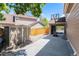 Spacious driveway with a basketball hoop and detached garage offers ample parking and recreational space at 9673 Pinebrook St, Highlands Ranch, CO 80130