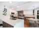 Well-lit kitchen with an island, hardwood floors, stainless steel appliances, and plenty of storage space at 9673 Pinebrook St, Highlands Ranch, CO 80130
