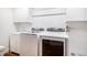 Laundry room featuring a washer, dryer, and built-in sink at 9673 Pinebrook St, Highlands Ranch, CO 80130