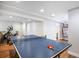 Spacious finished basement recreation room with ping pong table, great for entertainment and exercise at 9673 Pinebrook St, Highlands Ranch, CO 80130