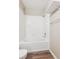 Bright bathroom featuring white tiles and a tub with shower at 9692 W Coco Cir # 103, Littleton, CO 80128