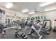 Well-equipped fitness center with modern exercise machines, weights, and a mirror wall at 9692 W Coco Cir # 103, Littleton, CO 80128