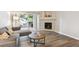Comfortable living room featuring a fireplace and access to outdoor space at 9692 W Coco Cir # 103, Littleton, CO 80128