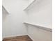 Spacious walk-in closet with built-in shelving and ample storage space at 9692 W Coco Cir # 103, Littleton, CO 80128