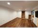 Unfinished basement with lots of potential and wood plank flooring at 971 S Evanston Cir, Aurora, CO 80012