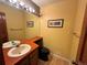 Cozy bathroom featuring a black toilet, and a vibrant countertop at 971 S Evanston Cir, Aurora, CO 80012