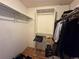 Walk in closet with a wood floor and built in shelving at 971 S Evanston Cir, Aurora, CO 80012