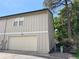 Home exterior showing a two-car garage, green shrubs and nice side yard at 971 S Evanston Cir, Aurora, CO 80012