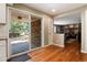 The floor plan flows from the kitchen to the living room, with a fireplace and access to the backyard at 9837 E Aberdeen Ave, Englewood, CO 80111