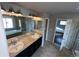 Lovely primary bathroom featuring double sinks, natural light and tile floors at 3231 Lump Gulch Way, Erie, CO 80516