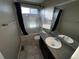 Cozy bathroom featuring a shower over tub and vanity with sink at 3231 Lump Gulch Way, Erie, CO 80516