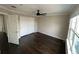 Light-filled bedroom with hardwood floors and double closet at 3231 Lump Gulch Way, Erie, CO 80516