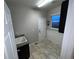 Functional mud room with sink, storage, and convenient access to the exterior at 3231 Lump Gulch Way, Erie, CO 80516