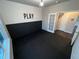 Modern playroom with black floor and PLAY decal on the wall at 3231 Lump Gulch Way, Erie, CO 80516