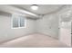 Cozy bedroom with neutral carpet and ample natural light from the glass block window at 1571 Vrain St, Denver, CO 80204