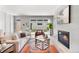 Cozy living room with a fireplace, comfortable seating, sliding glass doors to the backyard, and modern decor at 1571 Vrain St, Denver, CO 80204