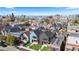 An aerial view of the property, neighborhood, and the Denver skyline in the background at 3725 N Franklin St, Denver, CO 80205