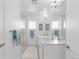 Bathroom featuring dual sinks, a large mirror, and a glass-enclosed shower at 3725 N Franklin St, Denver, CO 80205