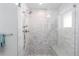 Contemporary shower with glass enclosure, mosaic tile walls, and a rainfall shower head fixture at 3725 N Franklin St, Denver, CO 80205