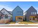 Modern two-story home featuring complementary exterior colors and manicured front yard at 3725 N Franklin St, Denver, CO 80205