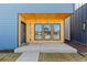 Inviting front porch featuring a wood-paneled ceiling and a modern blue door at 3725 N Franklin St, Denver, CO 80205
