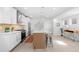 Modern kitchen with white cabinets, stainless steel appliances, and a large island with seating at 3725 N Franklin St, Denver, CO 80205