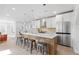 Bright, spacious kitchen with stainless steel appliances, a large island, and modern pendant lighting at 3725 N Franklin St, Denver, CO 80205