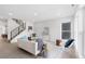 Open and airy living room with stylish décor and modern staircase at 3725 N Franklin St, Denver, CO 80205