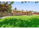 Beautiful backyard featuring lush green grass, a shed, and privacy fencing at 6353 W 78Th Ave, Arvada, CO 80003