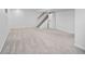 Spacious basement with carpeted floors, stairs, and white walls at 6353 W 78Th Ave, Arvada, CO 80003