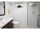 Updated bathroom featuring a modern vanity, stylish tile flooring, and a glass-enclosed shower at 6353 W 78Th Ave, Arvada, CO 80003