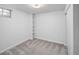 Bright bedroom featuring neutral carpet, built-in shelves, and ample natural light from a window at 6353 W 78Th Ave, Arvada, CO 80003