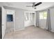 Spacious bedroom features gray walls, carpeted floors, ceiling fan, window, and large closet at 6353 W 78Th Ave, Arvada, CO 80003