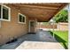 Covered patio featuring string lights with access to a well maintained yard and storage shed at 6353 W 78Th Ave, Arvada, CO 80003
