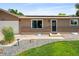 Well-maintained exterior with green lawn, tasteful landscaping, and solar panels at 6353 W 78Th Ave, Arvada, CO 80003
