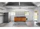 Spacious garage with shelving, storage, and a stainless steel refrigerator at 6353 W 78Th Ave, Arvada, CO 80003