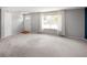 Bright living room with new carpet, neutral paint, and lots of natural light at 6353 W 78Th Ave, Arvada, CO 80003
