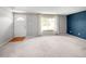 Spacious living room with new carpet, neutral paint, and lots of natural light at 6353 W 78Th Ave, Arvada, CO 80003