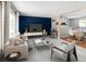 Bright living room featuring modern furniture, a large window, and an adjacent dining area at 6353 W 78Th Ave, Arvada, CO 80003