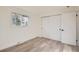Well-lit bedroom with ample closet space, offering a comfortable and functional layout at 2076 S Yates St, Denver, CO 80219