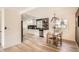 Open concept kitchen featuring stainless steel appliances and adjacent dining area at 2076 S Yates St, Denver, CO 80219