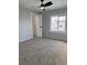 Bedroom with neutral walls, carpet floors, a ceiling fan, and a closet at 2619 S Bannock St, Denver, CO 80223
