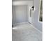 Inviting entryway featuring neutral walls and sleek marble tile flooring with a modern light fixture at 2619 S Bannock St, Denver, CO 80223