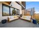 Relaxing backyard patio with stylish outdoor furniture and sun umbrella at 3485 S Clermont St, Denver, CO 80222