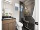 Modern bathroom features walk-in shower and floating vanity at 3485 S Clermont St, Denver, CO 80222