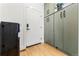 Hallway with olive green cabinets and hardwood floors at 3485 S Clermont St, Denver, CO 80222
