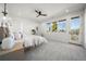 Main bedroom features natural light, ceiling fan and ensuite bathroom at 3485 S Clermont St, Denver, CO 80222