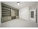 Office features a built in desk, shelving and storage with carpeted flooring at 3485 S Clermont St, Denver, CO 80222